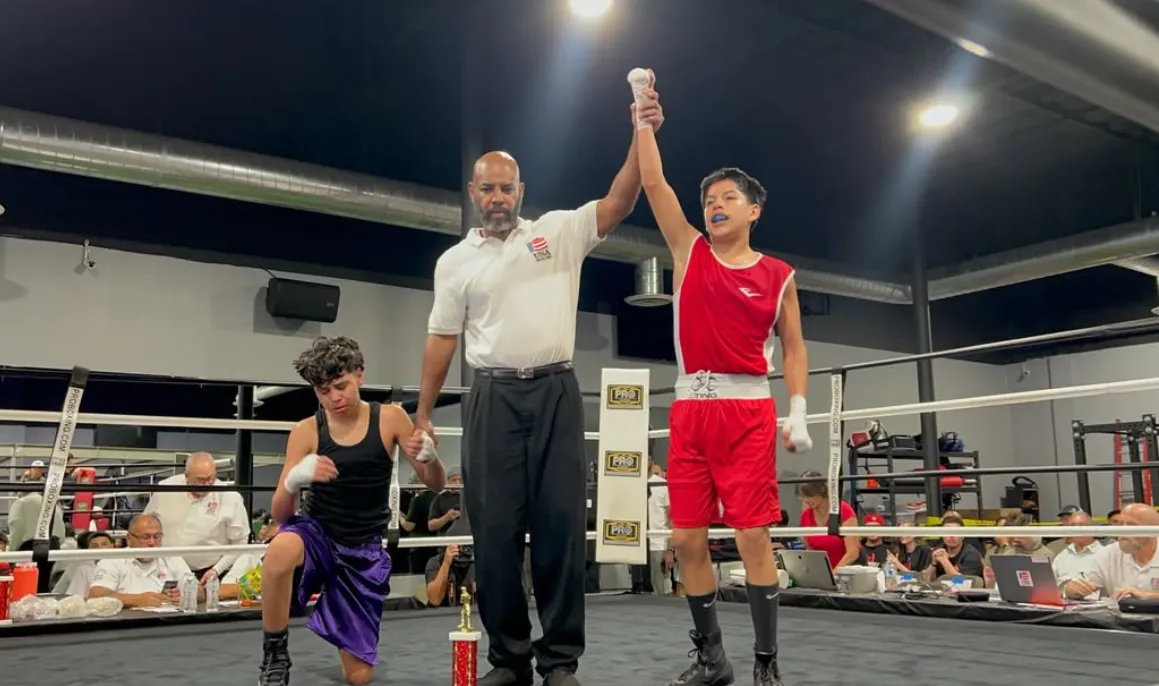 Young Lions Den boxer celebrating after a win
